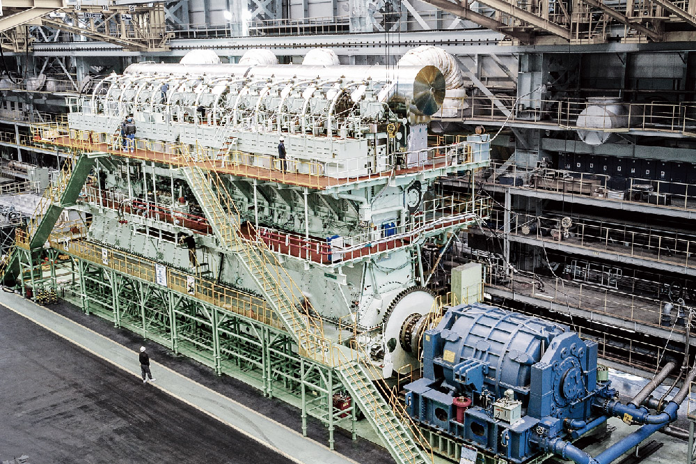 A large ship engine being retrofitted at an industrial facility 