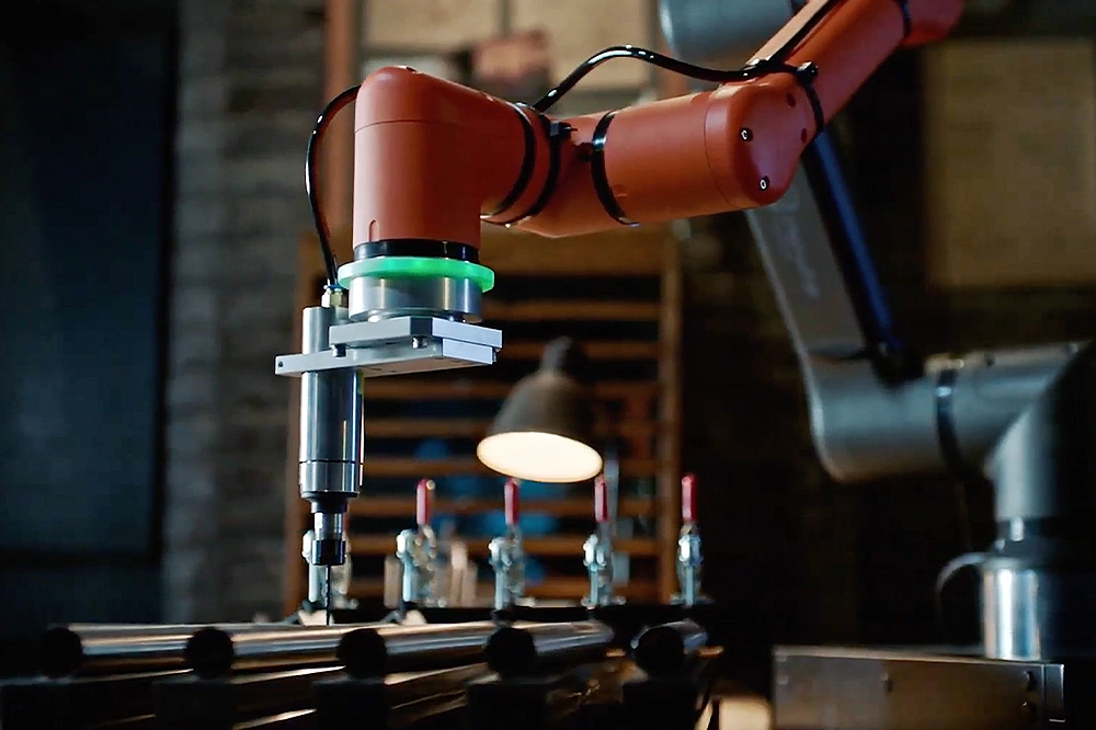 Closeup interior shot of a Hanwha cobot working at Geoje shipyard