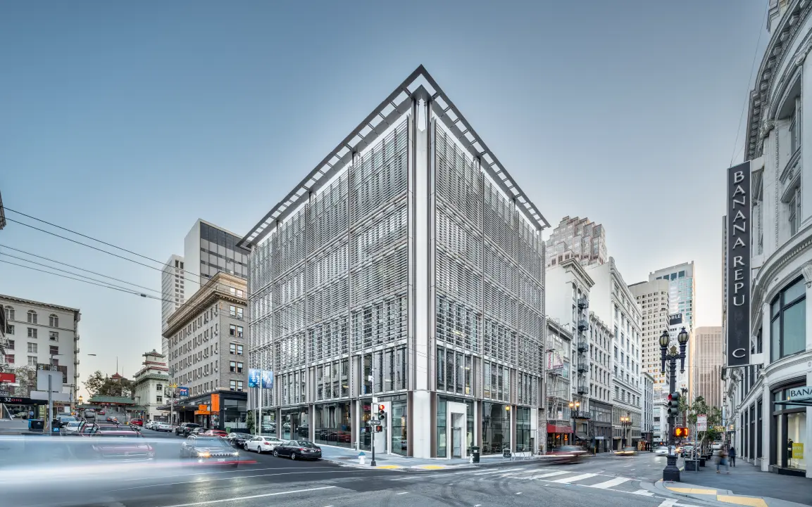 Hanwha AI Center, a modern building, pictured on a bustling San Francisco street